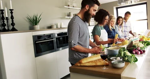 Friends playing and having fun in a kitchen Stock Footage 67000795