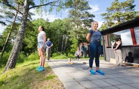 Friends Playing With Blocks While Standing Opposite To Each Othe 写真素材