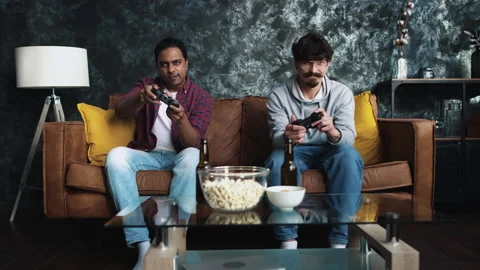 Friends Playing Console Games at Home. Friends at Couch. Gamers at Home. Guys Stock Footage 147164103