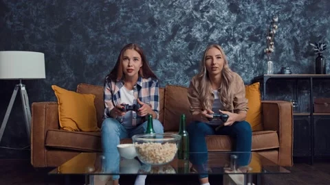 Friends Playing Console Games at Home. Friends at Couch. Gamers at Home. Girls Stock Footage 217891871