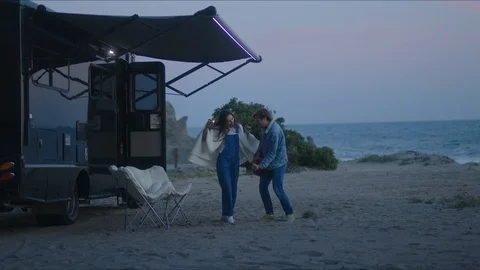 Friends playing guitar and dancing, chill evening at west coast of California Stock Footage 127409354