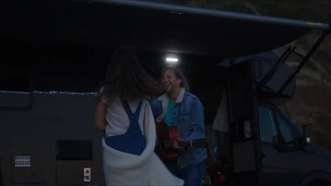Friends playing guitar and dancing, chill evening at west coast of California Stock Footage 127409594