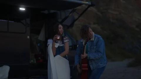Friends playing guitar and dancing, chill evening at west coast of California Stock Footage 127409612