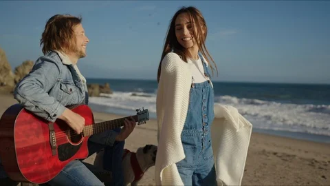 Friends playing guitar and dancing at west coast of California Stock-Footage 127409849