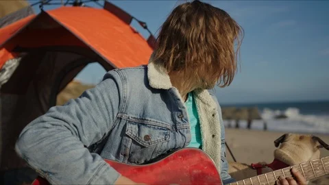 Friends playing guitar and dancing at west coast of California Stock Footage 127409887