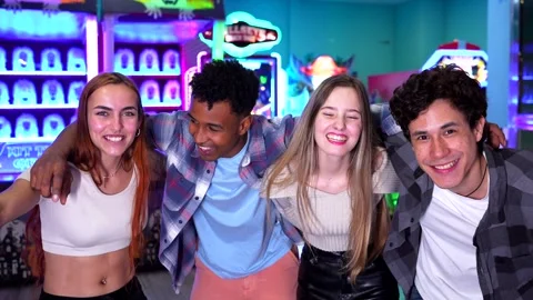 Friends posing together in an arcade Stock Footage 308262272