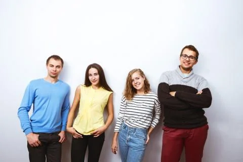 Friends posing white wall background Foto stock