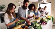 Friends Preparing Food In Kitchen Stock Footage