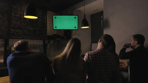Friends in pub on bar counter looking upset watching sport game on tv. Peeple Stock Footage 149254066