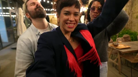 Friends pulling funny faces while taking selfie in night party Stock Footage 297351892