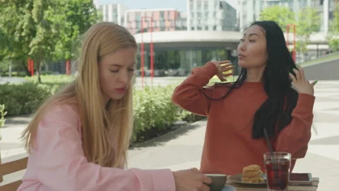 Friends React To Unexpected Moment During Outdoor Coffee Break Together 스톡 동영상 313844033