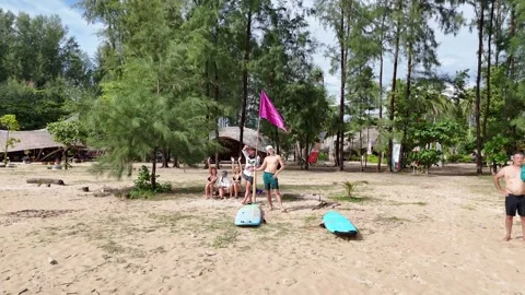 Friends Relax After Surf Session on Khao Lak Beach Vídeos de archivo 337969542
