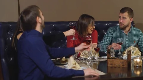 Friends at a restaurant drinking wine Stock Footage 70446133