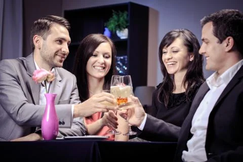 Friends in a restaurant Stock Photos