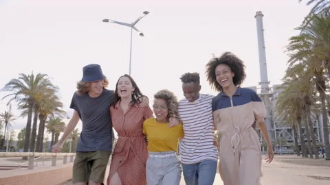 Friends run around hugging, having fun together during vacation. Group of young Stock Footage 170523836