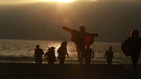 Friends Running On Beach At Sunset Stock Footage 36806691