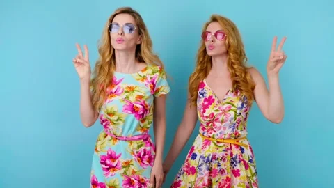 Friends sister dancing having fun, fashionable woman in floral dress excited rhy Video stock 246547791