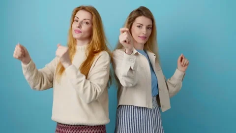 Friends sister dancing having fun, fashionable woman excited rhythm to music for Video stock 247787475