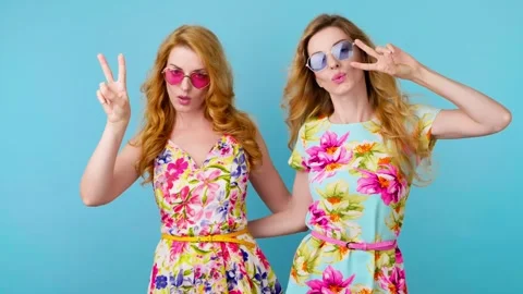 Friends sister dancing having fun, fashionable woman in floral dress excited rhy Stock Footage 256311458