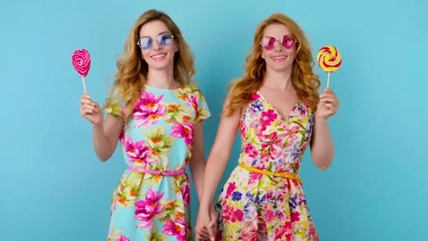 Friends sister dancing having fun, fashionable woman in floral dress excited rhy Stock Footage 256311745