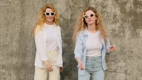 Friends sister having fun outside, fashionable woman smiling for confidence, pos 動画素材 249333095