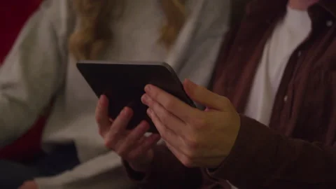 Friends Sit Holding Technology Stock Footage 208795812