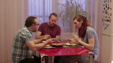Friends sit at the table and dinner Stock Footage 59789159