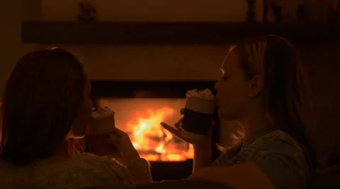 Friends sitting by the fire. Video stock 57725479