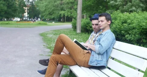 Friends sitting in the park. Stock Footage 52453353