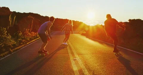 Friends Skateboarding at Sunset Stock Footage