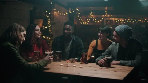 Friends smiling while having a toast with craft beers at the bar Video stock 132014032