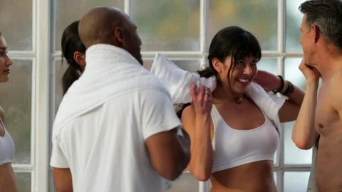 Friends smiling while wearing exercise clothing. 库存影片 88406175