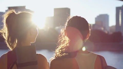 Friends Soak In The Last Rays Of Sun, In The City, On Way To Yoga Class Stock Footage 95961548