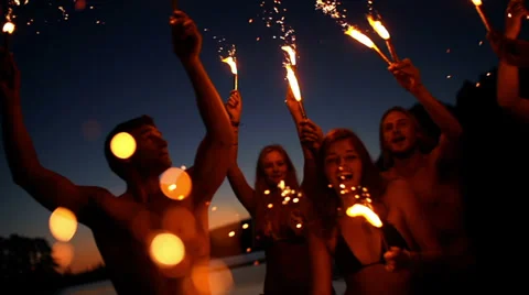 Friends with sparklers dancing Stock Footage