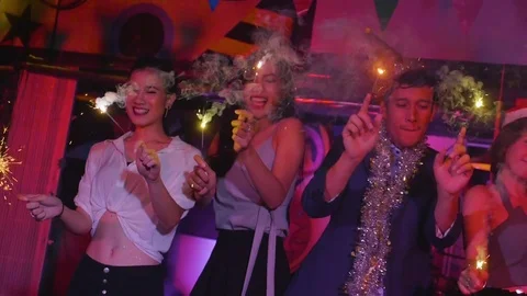 Friends with sparklers dancing Video stock 80535474