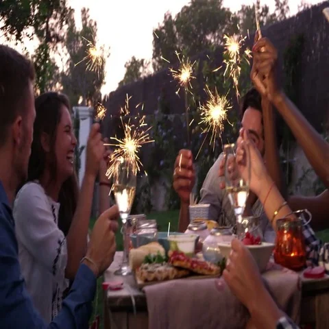 Friends With Sparklers Eating Food And Enjoying Party Stock Footage