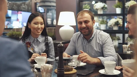 Friends spend time together for dinner in the restaurant. young man and girl Stock Footage 89795737
