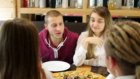 Friends spend time together in a pizzeria. Stock Footage