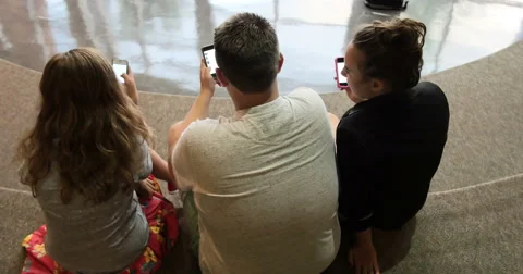 Friends (students) using their smart cell phones in school. Ultra HD 4K Stock Footage 45652165