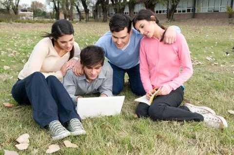 Friends studying together on the park Stock Photos
