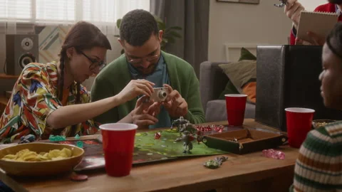 Friends Taking Picture with Camera While Enjoying Board Game Get-Together Stock Footage 335865743