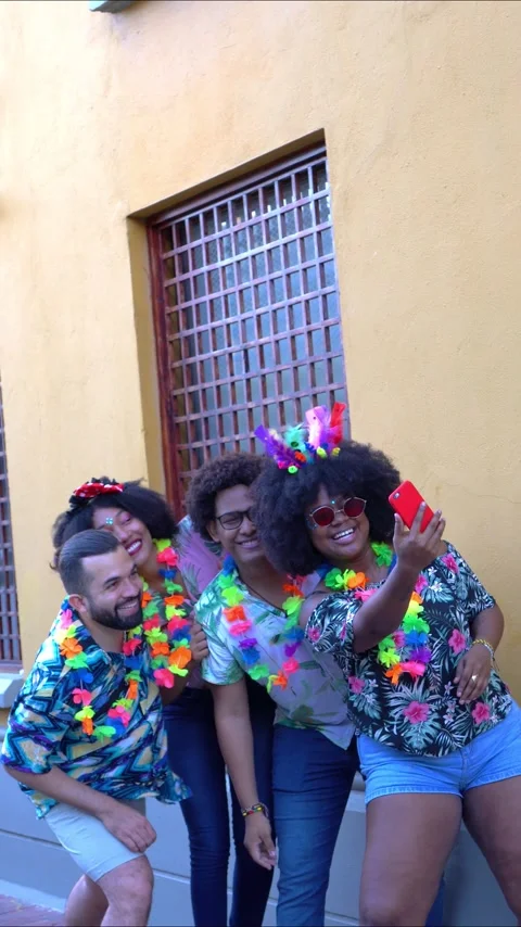 Friends taking a selfie while having fun at a carnival party Stock Footage 229700712