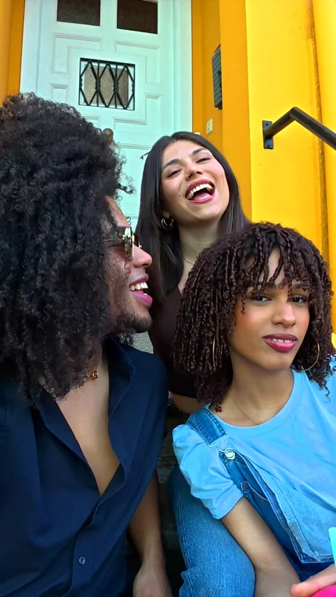 Friends taking selfies on colorful steps Stock Footage 309200215