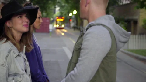 Friends talk while waiting for train Stock Footage 54260479