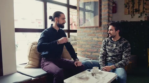 Friends talking and drinking coffee in a cafe Stock Footage 95900856