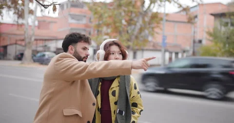 Friends Talking and Explaining on a City Street in Autumn Video stock 344828805