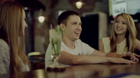 Friends talking in a bar Stock Footage 67975615