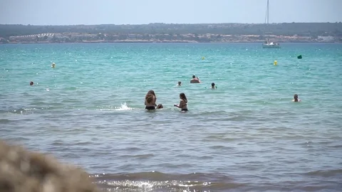 Friends talking at the beach Stock Footage 128349111