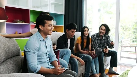 Friends talking together on sofa. Stock Footage 100666501