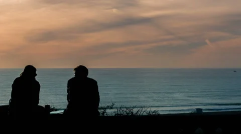 Friends Talking while Viewing Ocean during Sunset Silhouette People Scenic Beach 库存影片 45158635
